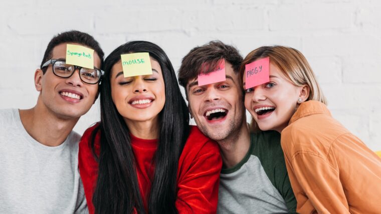 multicultural friends with funny nickname labels on foreheads