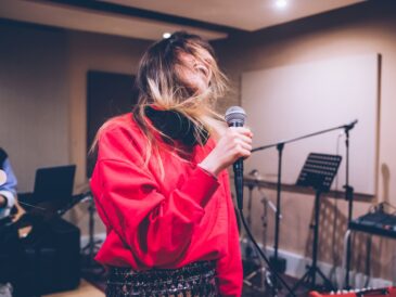 young woman singer rehearsing